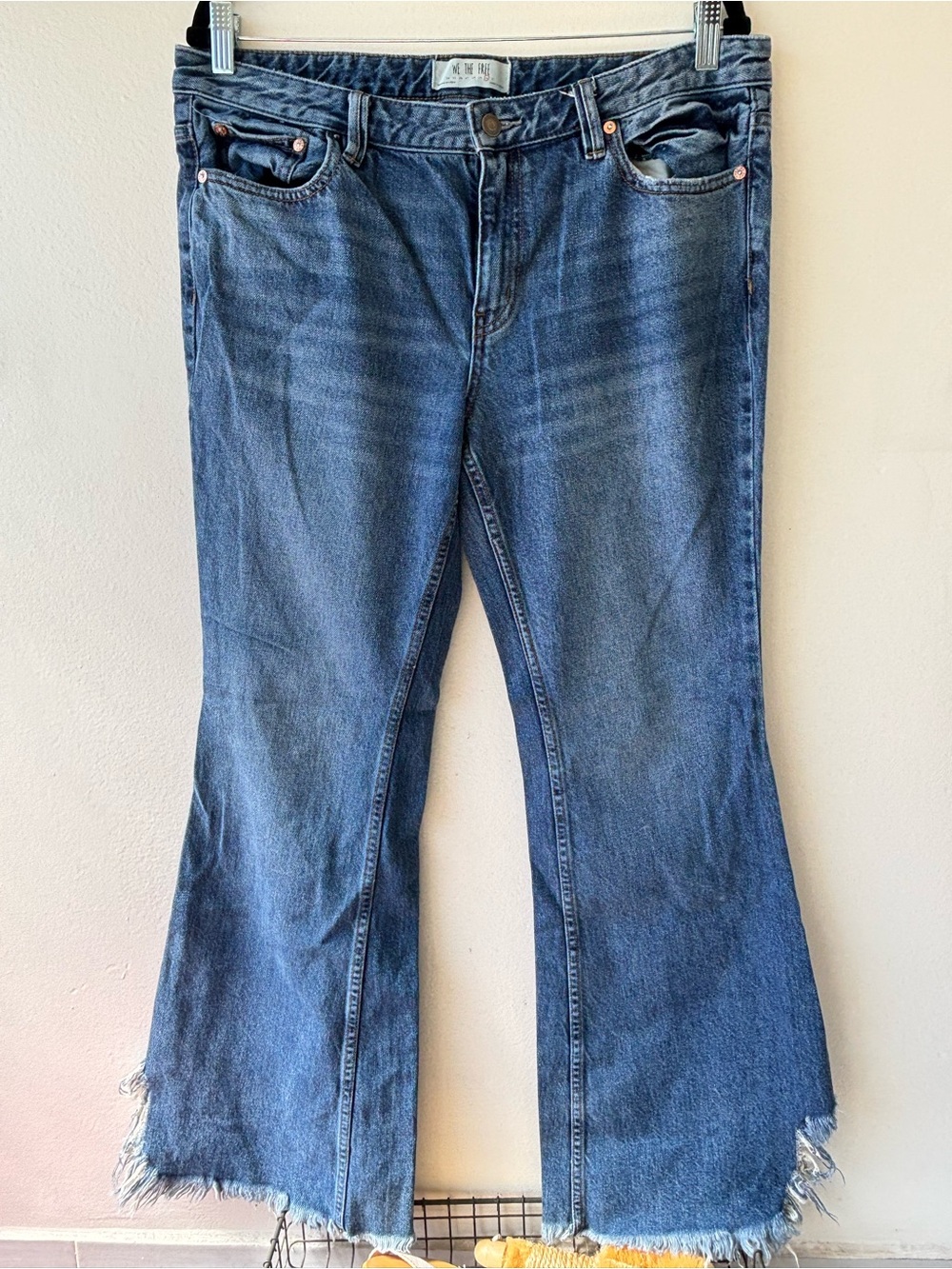 We The Free Mid-Blue Flare Jeans with Frayed Split Hem